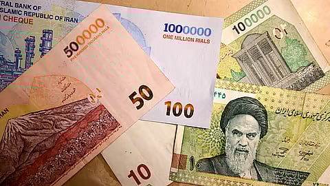 what reason of iran is removing four zeroes from its currency