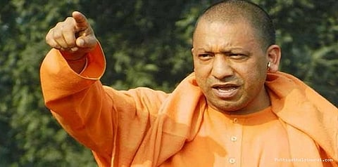 காவி அணிவதால் என்னை விமர்சிக்கிறார்கள்: யோகி ஆதித்யநாத் புகார்