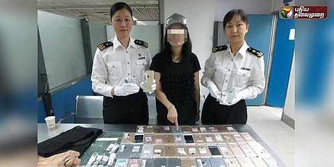 102 ஐபோன்களை ஆடைக்குள் மறைத்து கடத்த முயன்ற பெண் கைது