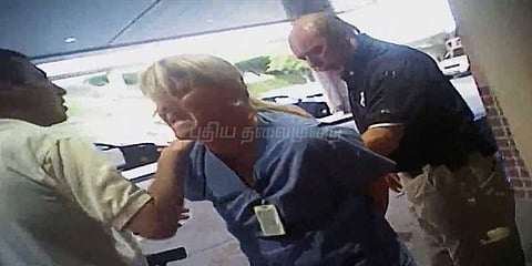 அமெரிக்காவில் செவிலியரை வன்முறையாக கைது செய்த காவலர்கள்