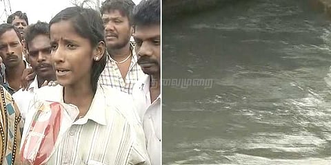 பாலத்தில் இருந்து ஆற்றில் தவறிவிழுந்த ஊழியர்