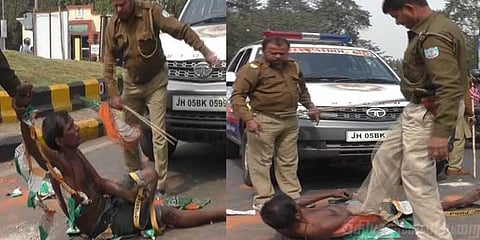 சாலையில் படுத்திருந்த மாற்றுத்திறனாளியை தாக்கிய போலீஸ்