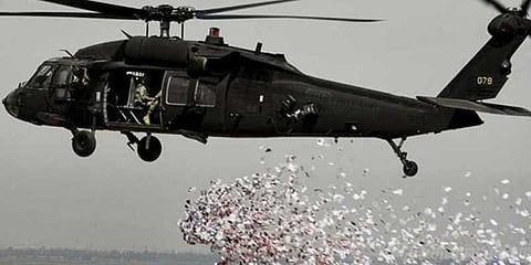 கிளர்ச்சியாளர்களுக்கு உதவாமல் இருந்தால் உதவிகள் கிடைக்கும்: சிரியாவில் துண்டுப் பிரசுரம் விநியோகம்