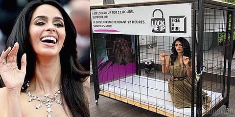 கூண்டுக்குள் அடைந்திருந்தபடி மல்லிகா ஷெராவத் விழிப்புணர்வு