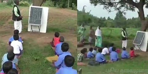 மழையில் மரத்தடியில் பாடம் படிக்கும் குழந்தைகள்