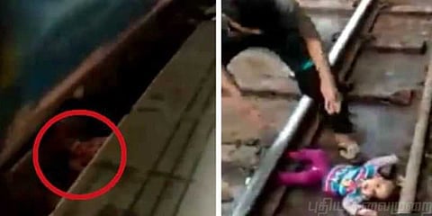 ஓடும் ரயிலுக்கிடையே தண்டவாளத்தில் விழுந்த குழந்தை : வைரல் வீடியோ