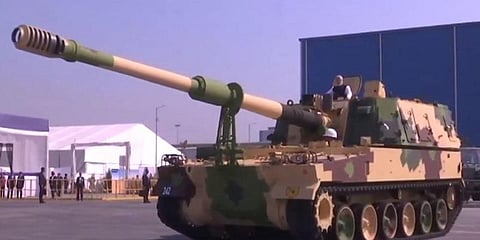 பீரங்கி ஆலையை திறந்து வைத்து பீரங்கியில் பயணித்த பிரதமர் மோடி