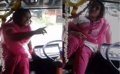 பேருந்தின் கேபின் முன் அமர்ந்து ஓட்டுநரிடம் தகராறு செய்த பெண் - வீடியோ