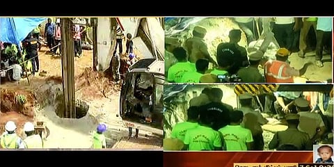 தோண்டப்பட்ட குழிக்குள் ஆக்சிஜன் சிலிண்டர் உதவியுடன் இறங்கிய வீரர்