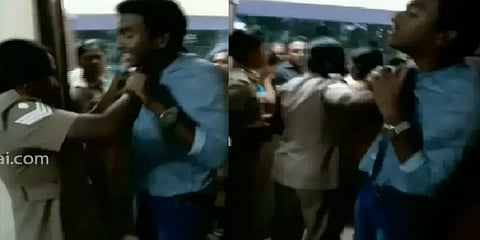 சட்டையைக் கொத்தாகப் பிடித்து இளைஞரை தாக்கிய பெண் காவலர்: வீடியோ