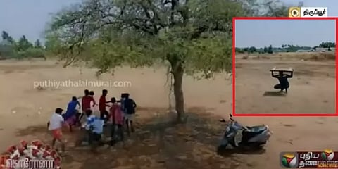 பொட்டல்காட்டில் கேரம்போர்டு விளையாடிய இளைஞர்கள்: ட்ரோன் கேமராவை பார்த்ததும் ஓட்டம்