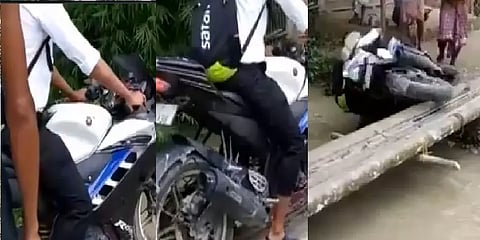 தடுமாறி நீரில் விழுந்த பைக்: அடித்துச்செல்லப்பட்ட நபர் - வீடியோ!