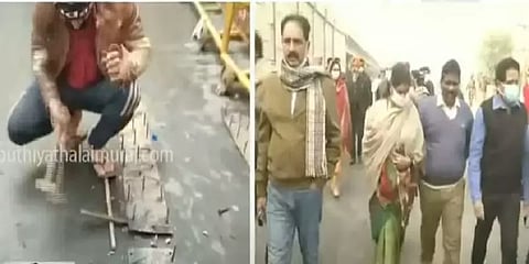 டெல்லி போராட்டம்: தடுப்புகளை அகற்றும் பணியில் விவசாயிகள்