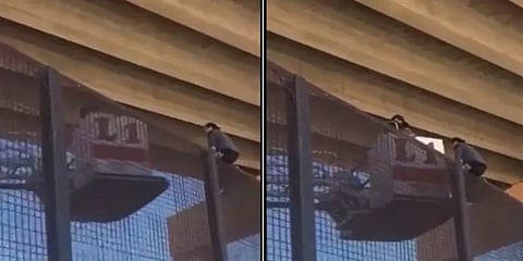 மெக்சிக்கோ - அமெரிக்கா எல்லையின் 18 அடி உயர இரும்பு வேலியில் ஏறி சிக்கிக் கொண்ட கர்ப்பிணி