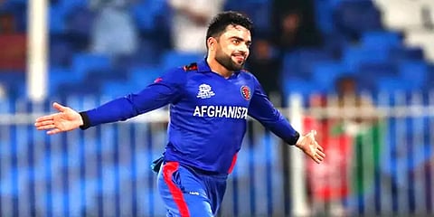 டி20 போட்டி: அதிவேகமாக 100 விக்கெட் வீழ்த்தி அசத்தி சாதனை படைத்த ரஷீத் கான்