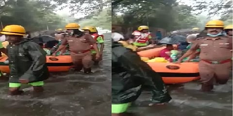 கொட்டும் மழையில் பிறந்து 4 நாட்களே ஆன 2 குழந்தைகளை பத்திரமாக மீட்ட தீயணைப்பு வீரர்கள்