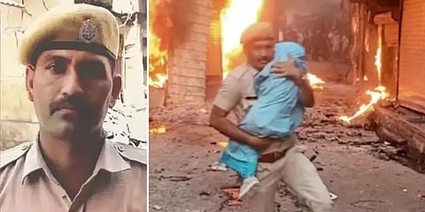 பற்றி எரிந்த கட்டடம்... சூப்பர் ஹீரோ போல தீயிலிருந்து குழந்தையை மீட்ட காவலர்