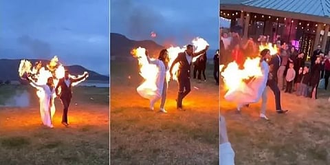 திருமண வரவேற்பில் தங்கள் மீதே தீவைத்து ஸ்டண்ட் செய்த மணமக்கள் - வைரல் வீடியோ