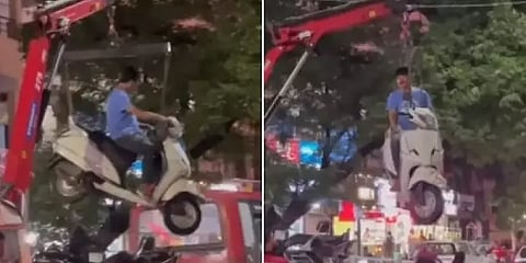 வண்டியோடு சேர்த்து டிரைவரை தூக்கிய டிராஃபிக் போலீஸ் வாகனம்.. வைரல் வீடியோவால் பரபரப்பு!