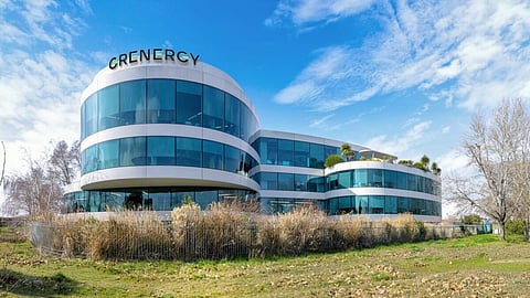 A modern glass-fronted office building complex serving as Grenergy’s corporate headquarters