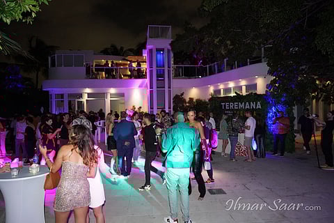 Creativo guests mingle at a mansion party on Star Island.