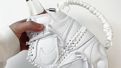 HARDWORKUP's new signature Wine Bag, an original repurposed Nike sneaker design by Korean artist Jisoon Kim, which has inspired many iterations from other designers since its viral inception.