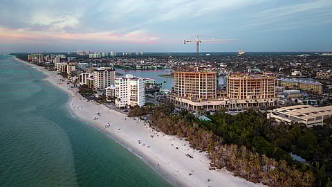 The RCR, Naples celebrate a milestone as luxury towers near completion