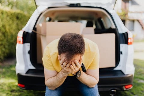 Person holding their face