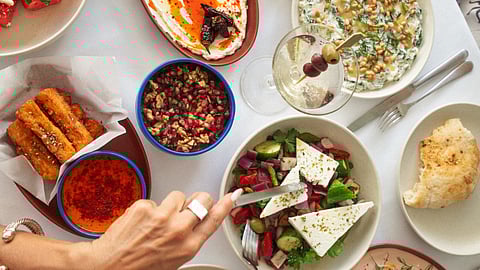 Cleo's Miza Dips, Mezze Spread, Greek Salad, and Watermelon & Feta Salad