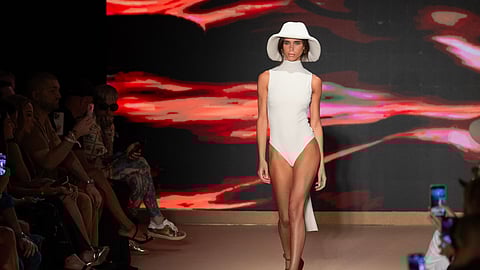 Sleek White One-Piece and Sun Hat