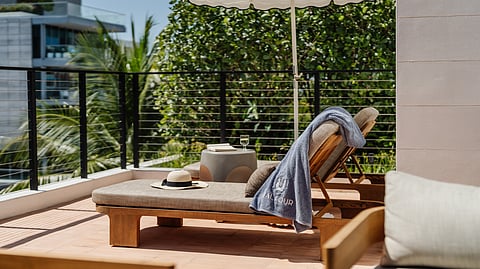 Private Rooftop Lounge Chairs with Balfour Embroidered Towels