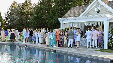 Conversation Beside the Pool at the French Heritage Society Summer Soirée