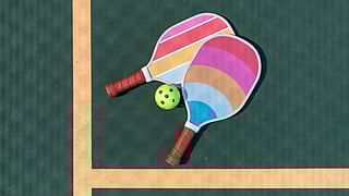 Pickleball Paddles on the court at Mission Bay Resort