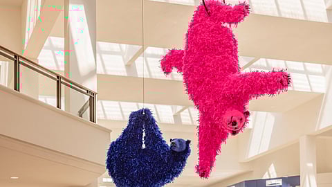 Pink and blue feathered bear sculptures by Paola Pivi at Aventura Mall