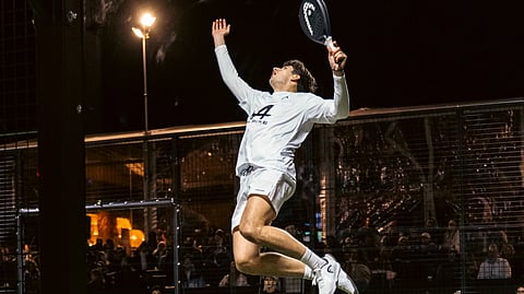 Padel player midair smash shot reserve cup