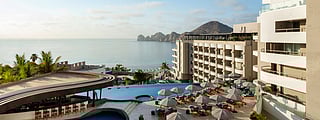 Luxury resort pool deck at Corazón Cabo overlooking the ocean