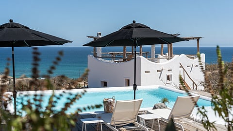 Poolside lounge with ocean views at NEST Baja