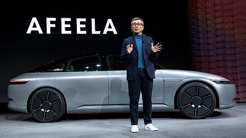 Spotlighted Afeela 1 concept car on stage at CES 2025