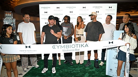 Guests and celebrities gather for Cymbiotika Wellness Bar ribbon cutting