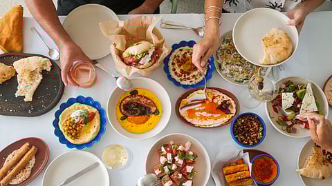 A table filled with Eastern Mediterranean mezze dishes at Cleo