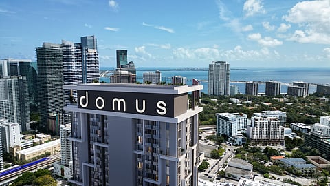 Domus Brickell Center tower against Miami skyline