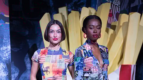 Two models in Americana print outfits on NYFW runway