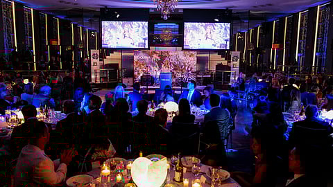 Guests seated at candlelit tables during Oceana’s New York Gala