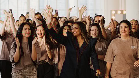 Albania Rosario walking down the runway with the FDLA team