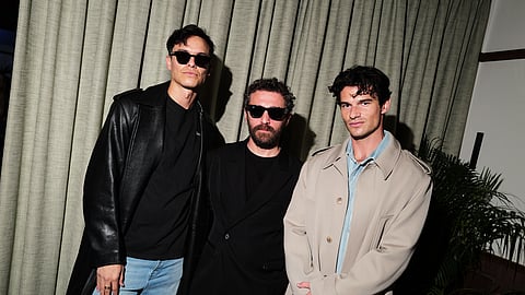 David Koma poses with guests at his 15th anniversary celebration in London