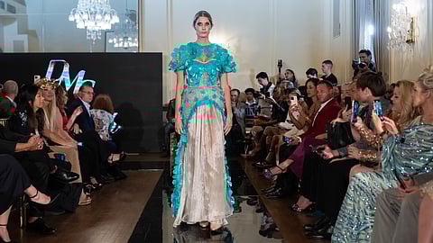 Model in turquoise gown on NYFW runway
