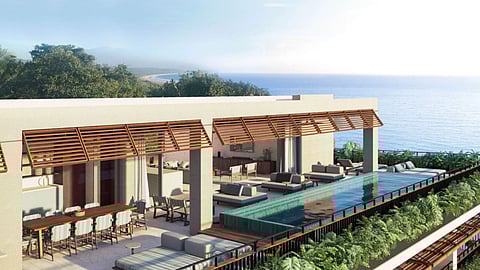 Oceanview villa terrace with infinity pool and lounge seating