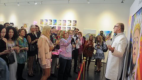 Guests attend Roger Sichel’s Iconic Smokin’ Hot Kiss exhibition