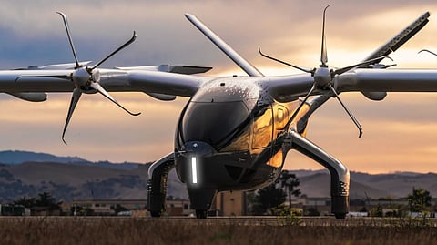 Archer eVTOL aircraft on runway at sunset with propellers extended