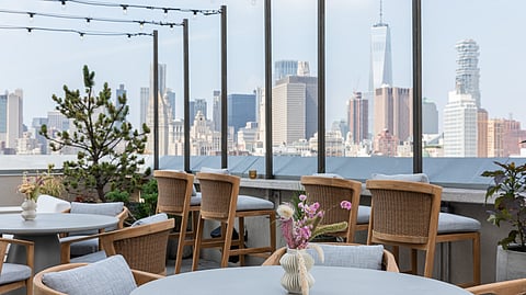 Rooftop terrace with city skyline and modern outdoor seating